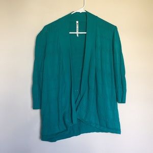 Beautiful turquoise cardigan with stripe details.